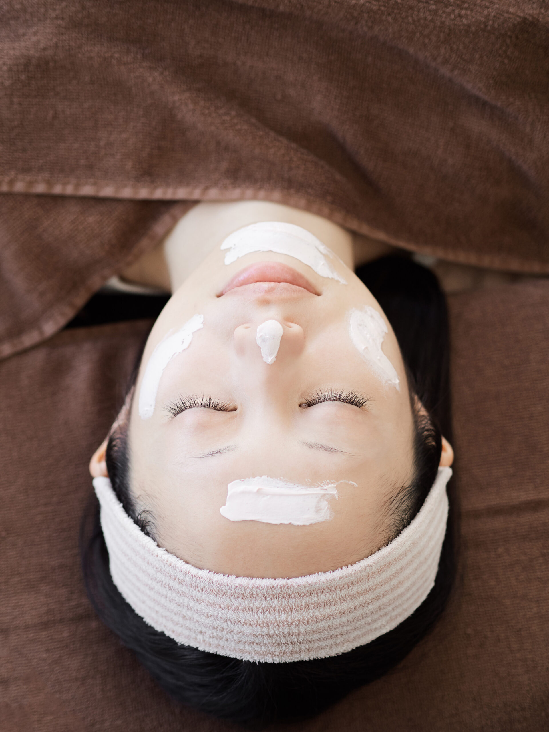 Japanese women receiving facial care